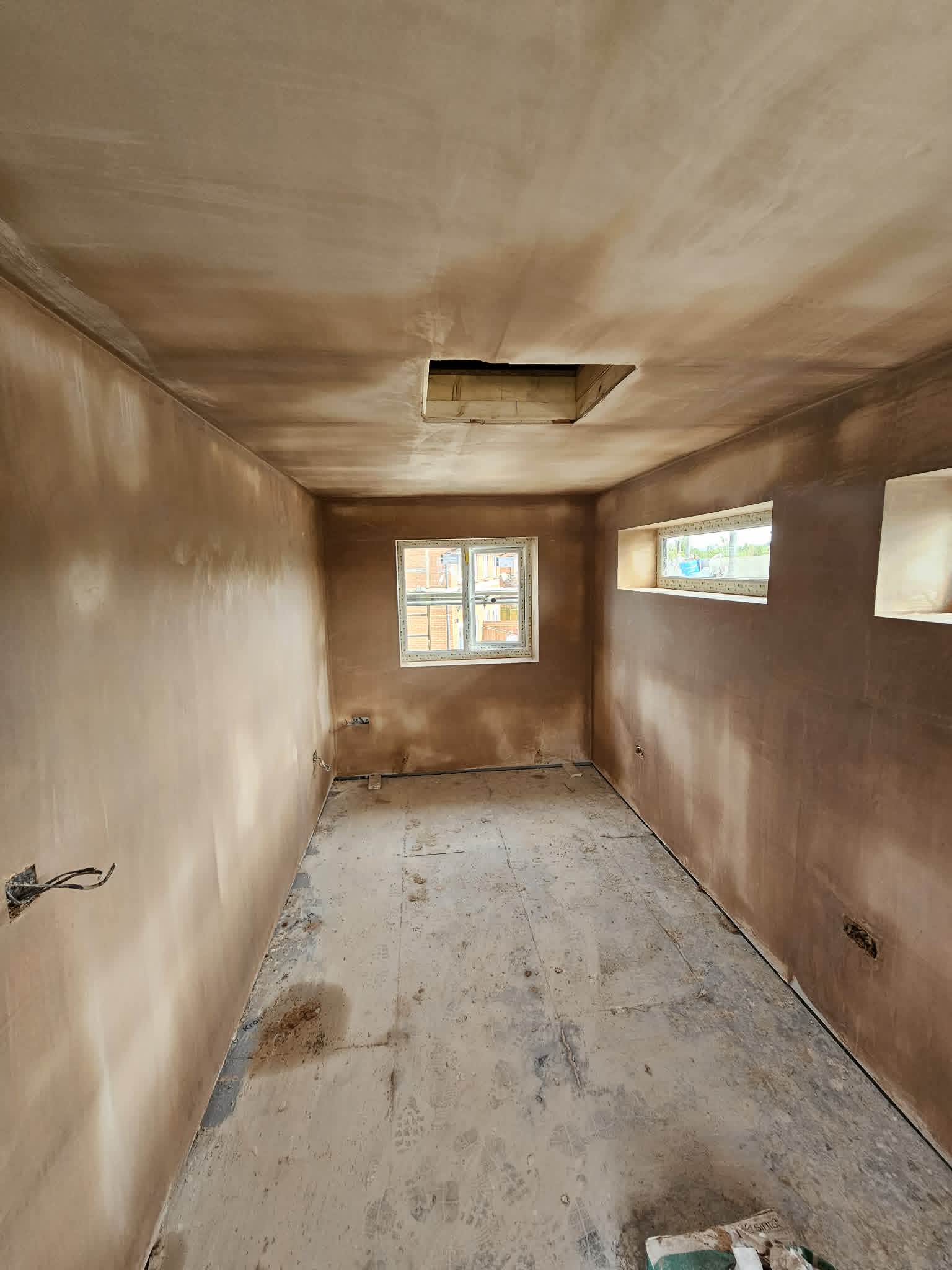 Complete room with freshly skimmed walls and ceiling