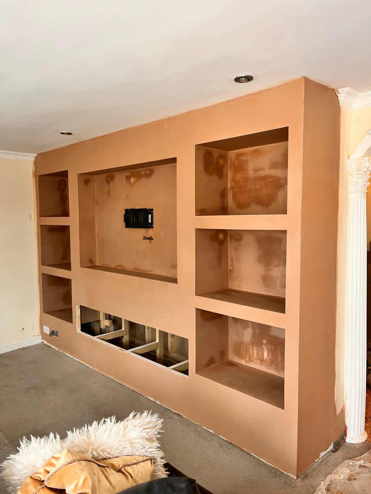 Bespoke media wall during the plastering stage